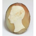 A Victorian carved shell cameo brooch,of a young gentleman facing left, in light buff to a tan
