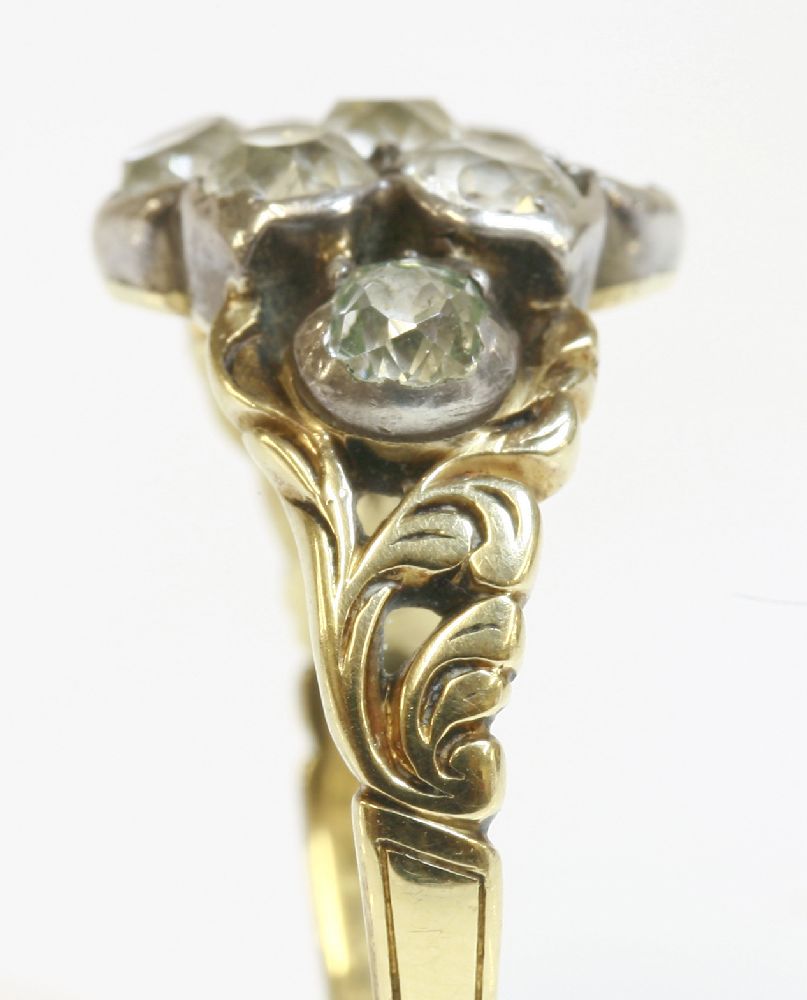 A Victorian nine stone diamond daisy cluster ring with diamond set shoulders,a seven stone diamond - Image 2 of 2