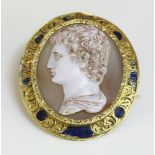 A Victorian agate and glass composite cameo brooch,with an opaque white glass cameo of an emperor,