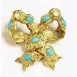 A Victorian turquoise and chrysolite bow brooch,with a rippled ribbon forming the bow, rub set
