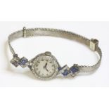 A ladies' Art Deco diamond and sapphire cocktail watch, c.1925,a circular silvered dial with