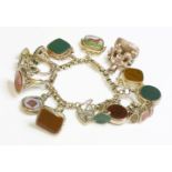 A gold charm bracelet,with faceted belcher links between scalloped box links with diaper decoration.