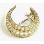 A late Victorian split pearl and diamond crescent brooch, c.1900,with two rows of graduated split