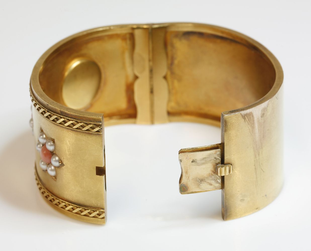 A Victorian coral and split pearl gold hinged bangle,a flat section hinged bangle, 32mm wide, with - Image 2 of 2