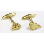 A pair of late Victorian gold nugget style cufflinks,each with a molten effect nugget to chain and