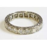 A diamond set full eternity ring,with brilliant cut diamonds, grain set to a flat section band