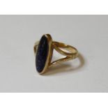 A 9ct gold dark blue synthetic goldstone ring