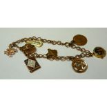 A 9ct gold twisted wire figure of eight link bracelet, with five gold charms and three gilt metal