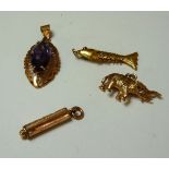 A synthetic colour change sapphire pendant, tested as approximately 18ct gold, two 9ct gold