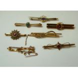 Seven gold bar brooches, variously set with diamonds, split pearls and amethyst