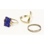 A 9ct gold wishbone ring, a three colour gold ring, and an Art Deco carved lapis lazuli plaque