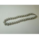 A single row graduated cultured freshwater pearl necklace, with a silver clasp