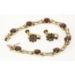 A 9ct gold garnet bracelet, by Cropp and Farr, together with a pair of Bohemian garnet earrings