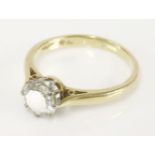 An 18ct gold single stone diamond ring, with a brilliant cut diamond estimated as approximately 0.