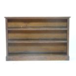 An oak open bookcase, 129cm wide