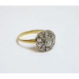 An eleven stone diamond cluster ring, finger size O