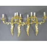 A set of four gilt bronze double wall lights