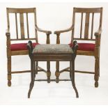 A pair of early 20th century oak elbow chairs, and a piano stool