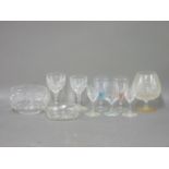 A collection of glassware, including cut glass decanters, and finger bowls