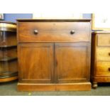 A mahogany drop front chest, with pigeon hole interior, with cupboard below