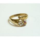 A ruby and diamond gold snake ring, marked 375, finger size P½