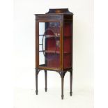 An Edwardian inlaid mahogany display cabinet, 61cm wide, 150cm high, 32cm deep