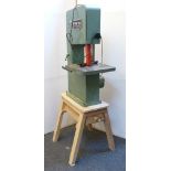 A Startrite bandsaw, 16cm height of cut, on wooden trestle stand