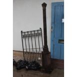 A cast iron gate post, and gate, post 192cm high