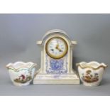 A pottery mantel clock, with blue printed decoration, 27cm high, and a pair of cachepots with