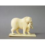 A 19th century ivory figure of a lioness with cub