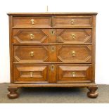 An 18th century oak chest of five drawers, with geometrical mouldings