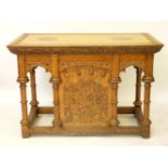 A Victorian carved light oak altar, with carved vines and turned columns, with cupboard in back,