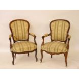 A pair of 19th century rosewood open armchairs