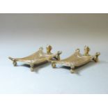 A pair of early 20th century bronze trays, modelled as a devil beneath an outstretched blanket,