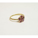 A six stone spinel daisy cluster ring, marked 18ct, finger size J