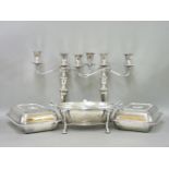 A silver plated revolving breakfast dish, a pair of entrée dishes, a pair of three branch