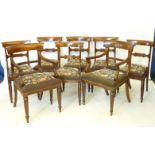 A set of eight Victorian mahogany bar back dining chairs, with drop in tapestry seats and turned