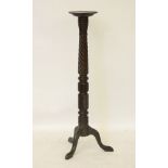 A carved mahogany torchère, 122cm