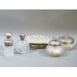 Five Victorian and later silver topped dressing table bottles, and a silver dish