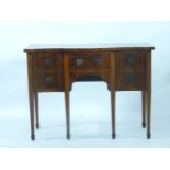 A reproduction mahogany serpentine sideboard, 125cm wide