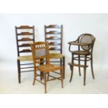 A 'Thonet' bentwood child's high chair, a pair of ladderback chairs, and another