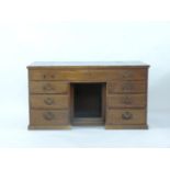 A Victorian mahogany pedestal desk of seven drawers, with inset green leather writing surface, 146cm