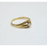 A single stone diamond ring, tested as approximately 18ct gold, finger size M½