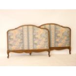 A French walnut and beechwood bed, with upholstered head/foot board, 4ft