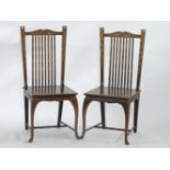 An unusual pair of Arts and Crafts single chairs, with mother of pearl inlay