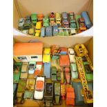 Two boxes of old Dinky toys, including commercial vehicles, cranes, forklift, racing cars, etc