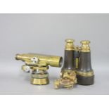 A pair of brass and leather binoculars, a surveyor's brass level by Watts, and another pocket