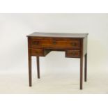 A mahogany table, central drawer over two small drawers, on square legs, 80cm wide