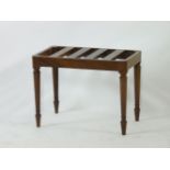 A 19th century mahogany luggage rack, on turned supports