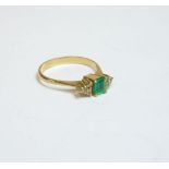 A seven stone emerald and diamond ring, tested as approximately 18ct gold, finger size K½